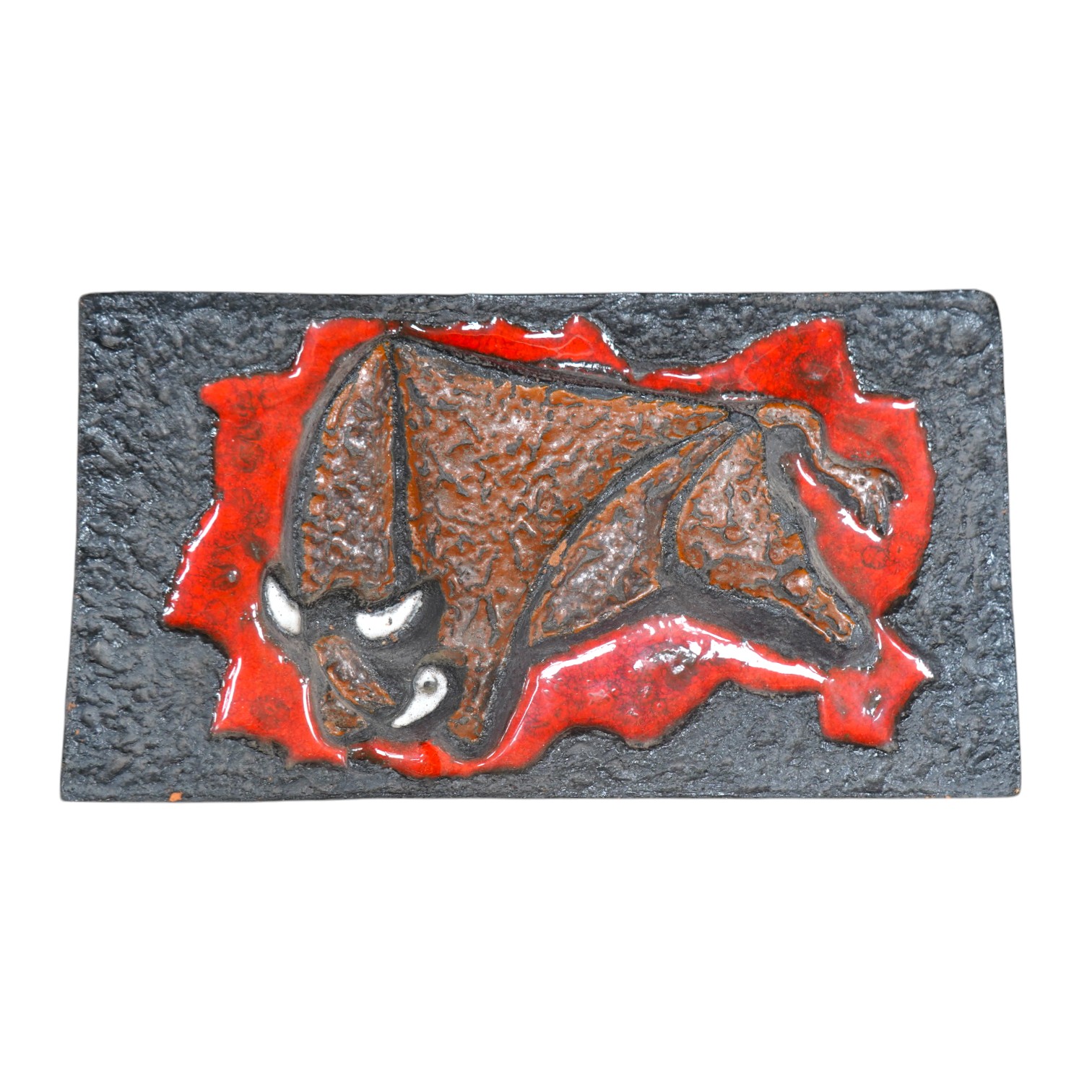 A West German terracotta wall plaque “The Bull”, 41cm wide, 23cm high. Condition - fair